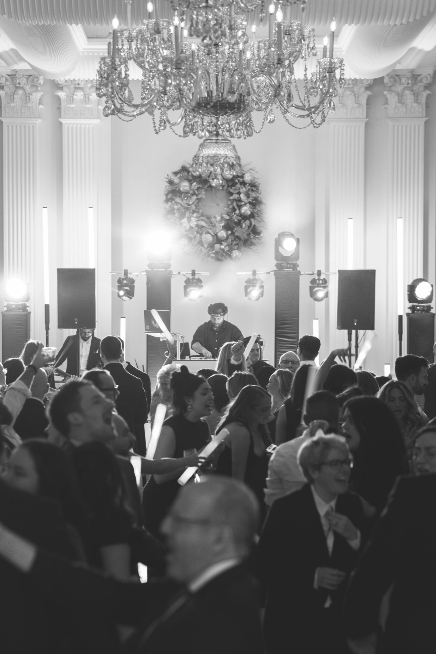 Packed ballroom dance floor with Jon at the decks
